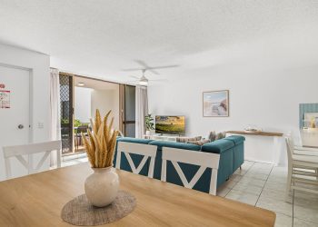 Dining and living space at Alexandria Apartments Unit 5 which is a 2 bedroom with Ocean View